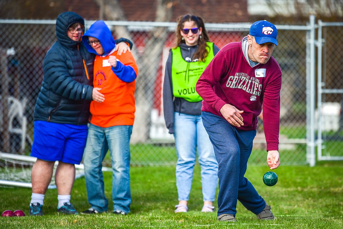 Ryan Trout with the Lighthouse Christian Home team tosses the bocce ball at the Special Olympics Glacier Area Spring Games outside Legends Stadium in Kalispell on Thursday, April 27. The games continue Friday with track and field and cycling at Legends Stadium and aquatics at Logan Health Medical Center. (Casey Kreider/Daily Inter Lake)