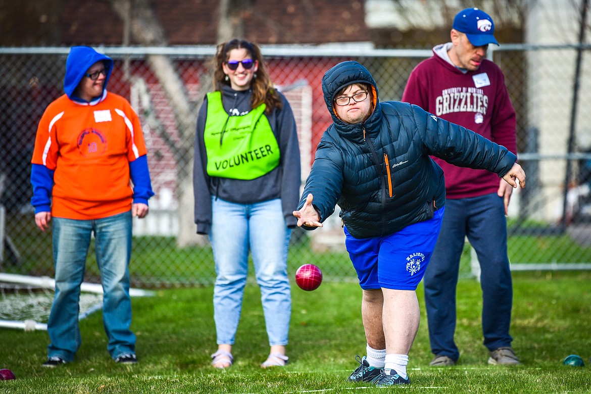 Michael Stark with the Lighthouse Christian Home team tosses the bocce ball at the Special Olympics Glacier Area Spring Games outside Legends Stadium in Kalispell on Thursday, April 27. The games continue Friday with track and field and cycling at Legends Stadium and aquatics at Logan Health Medical Center. (Casey Kreider/Daily Inter Lake)