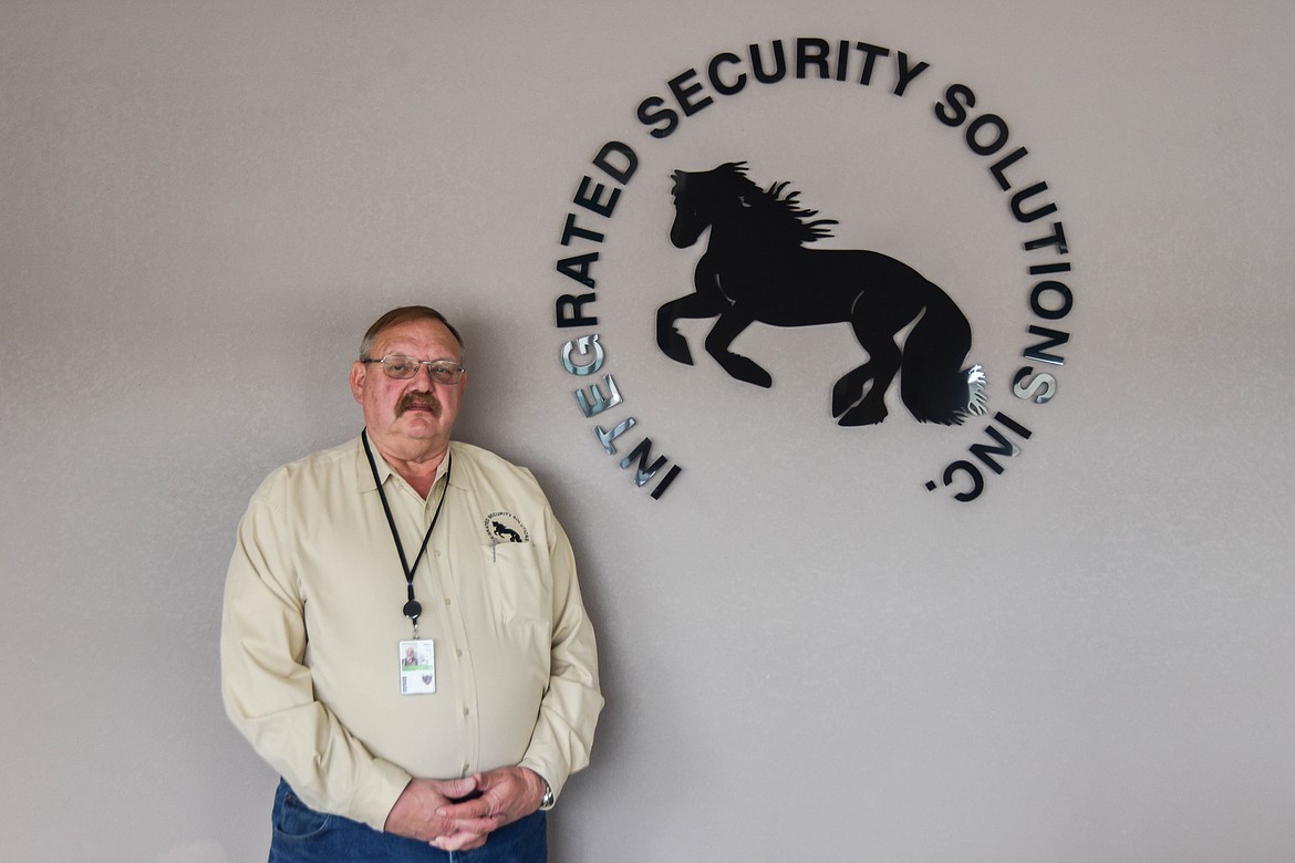 Marquis Laude, the president of Integrated Security Solutions, Inc. stands for a portrait at the company office in Evergreen on April 25, 2023. (Kate Heston/Daily Inter Lake)