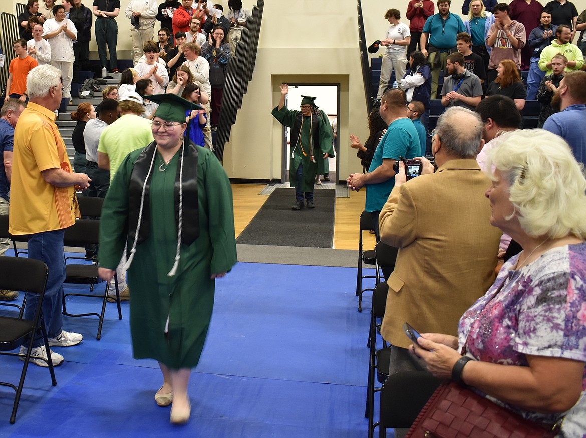 Kalaya Jackson enters the Columbia Basin Job Corps Center gym for her graduation ceremony, followed by Jesus Angel Lizarraga.