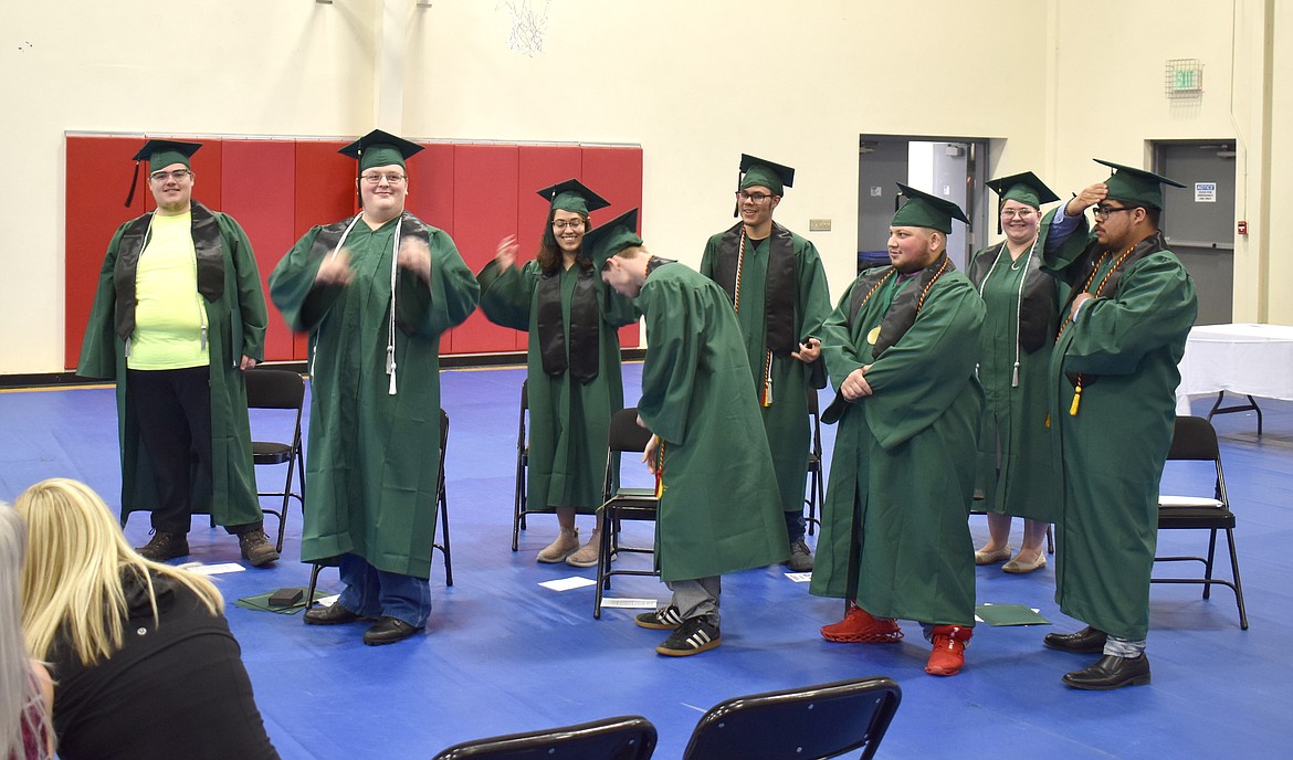 The eight new graduates from Columbia Basin Job Corps Center turn their tassels. From left: Tyler South, Jacob Humphries, Illyana Reyes, Jaydan Davis, Jesus Angel Lizarraga, Micheal Baker Jr., Kalaya Jackson and Isaias Alvarez.