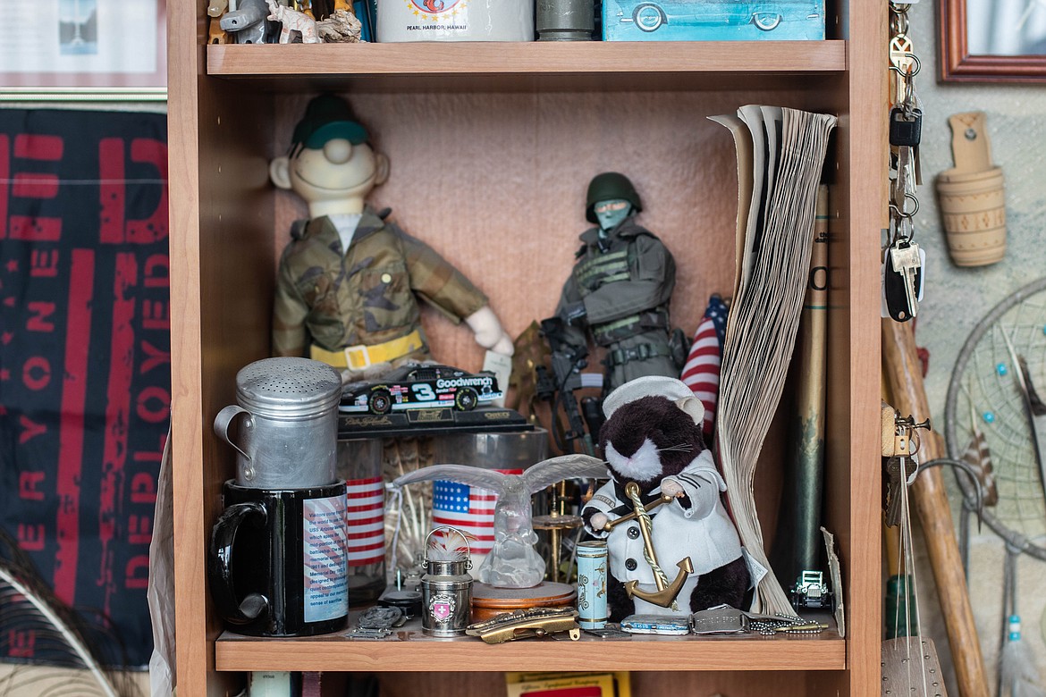 A shelf in Allen Erickson's office at the Northwest Montana Veterans Food Pantry is seen on April 20, 2023. Erickson's office is full of army memorabilia, plants, and dreamcatchers. (Kate Heston/Daily Inter Lake)