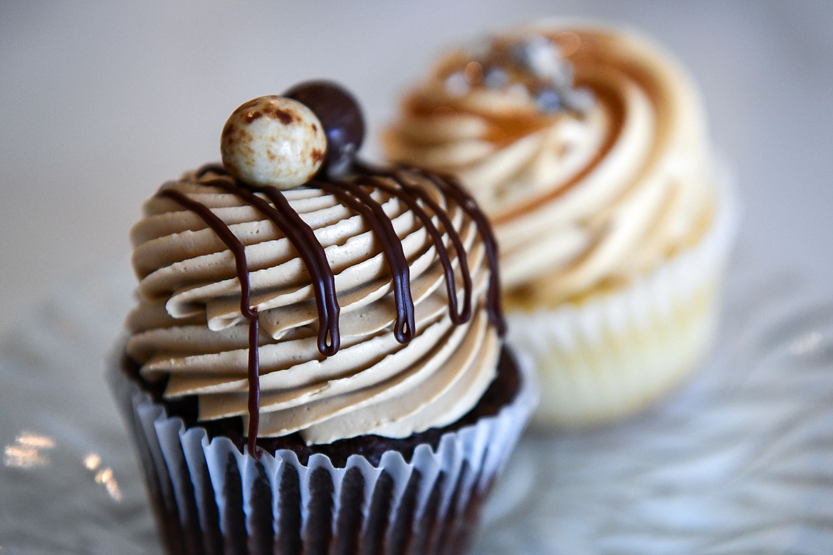 An espresso chocolate cupcake and a vanilla with dulce de leche cupcake at Bonjour Bakery & Bistro in Kalispell on Thursday, April 27. (Casey Kreider/Daily Inter Lake)