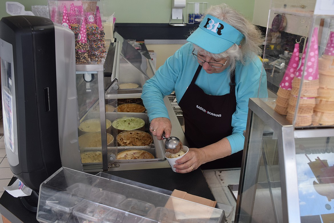 Lori Friend scoops up some ice cream. Like the number of flavors available at Baskin Robins, Friend’s career has seen 31 variations, when counted in years.