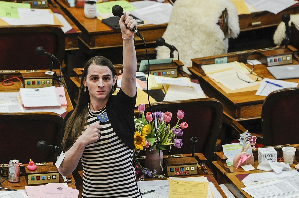 State Rep. Zooey Zephyr, D-Missoula, alone on the house floor stands in protest as demonstrators are arrested in the house gallery, Monday, April 24, 2023, in the Montana State Capitol in Helena, Mont. (Thom Bridge/Independent Record via AP, File)