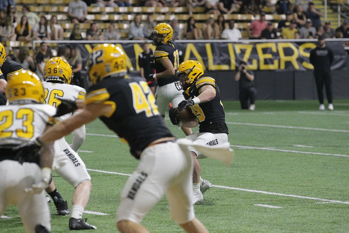 MARK NELKE/Press
Idaho running back Trent Elstad, from Coeur d'Alene High, scores on a 1-yard touchdown run during the first half of the Vandals' spring football game Friday night at the Kibbie Dome in Moscow.