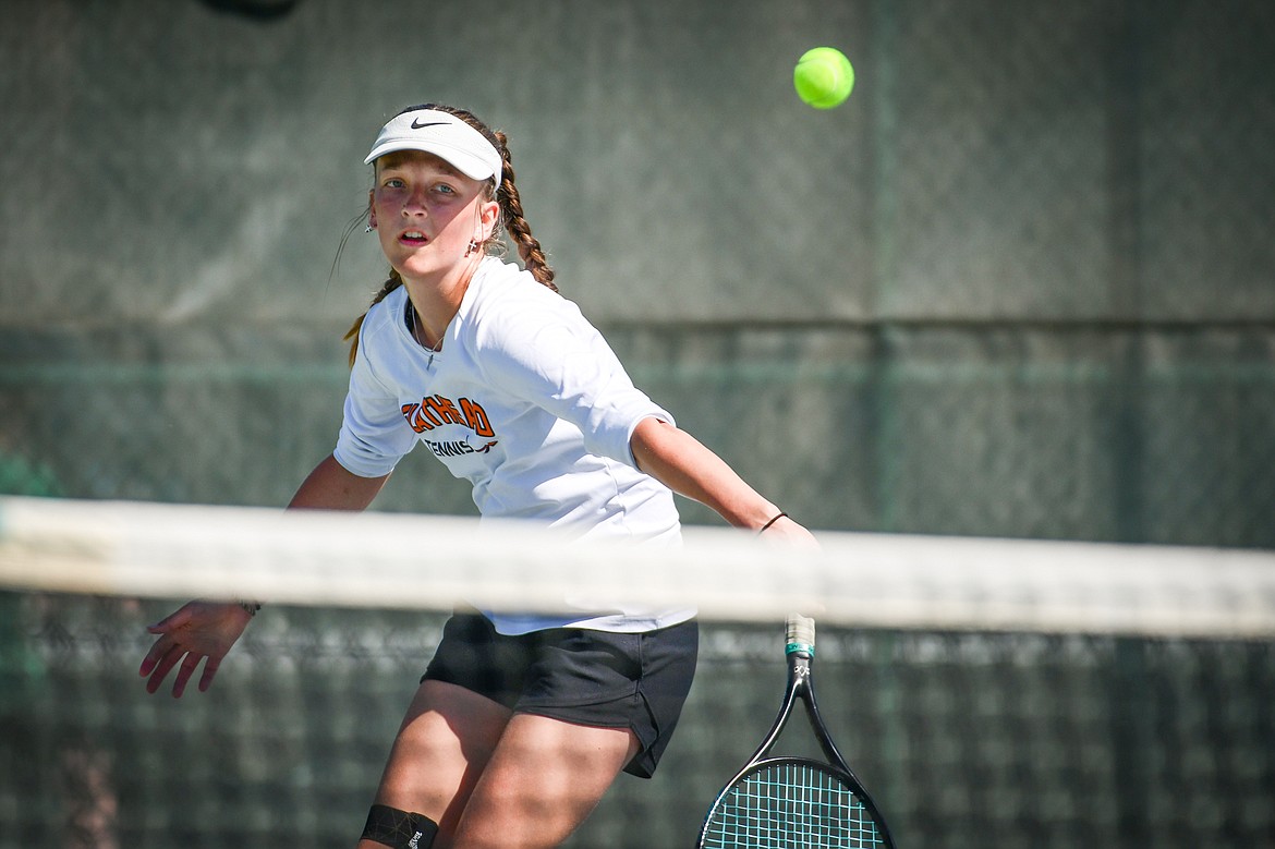 Flathead's Alexis Kersten hits a backhand return against Missoula Big Sky's Addie Winward at the Western AA Invite at FVCC on Saturday, April 29. (Casey Kreider/Daily Inter Lake)