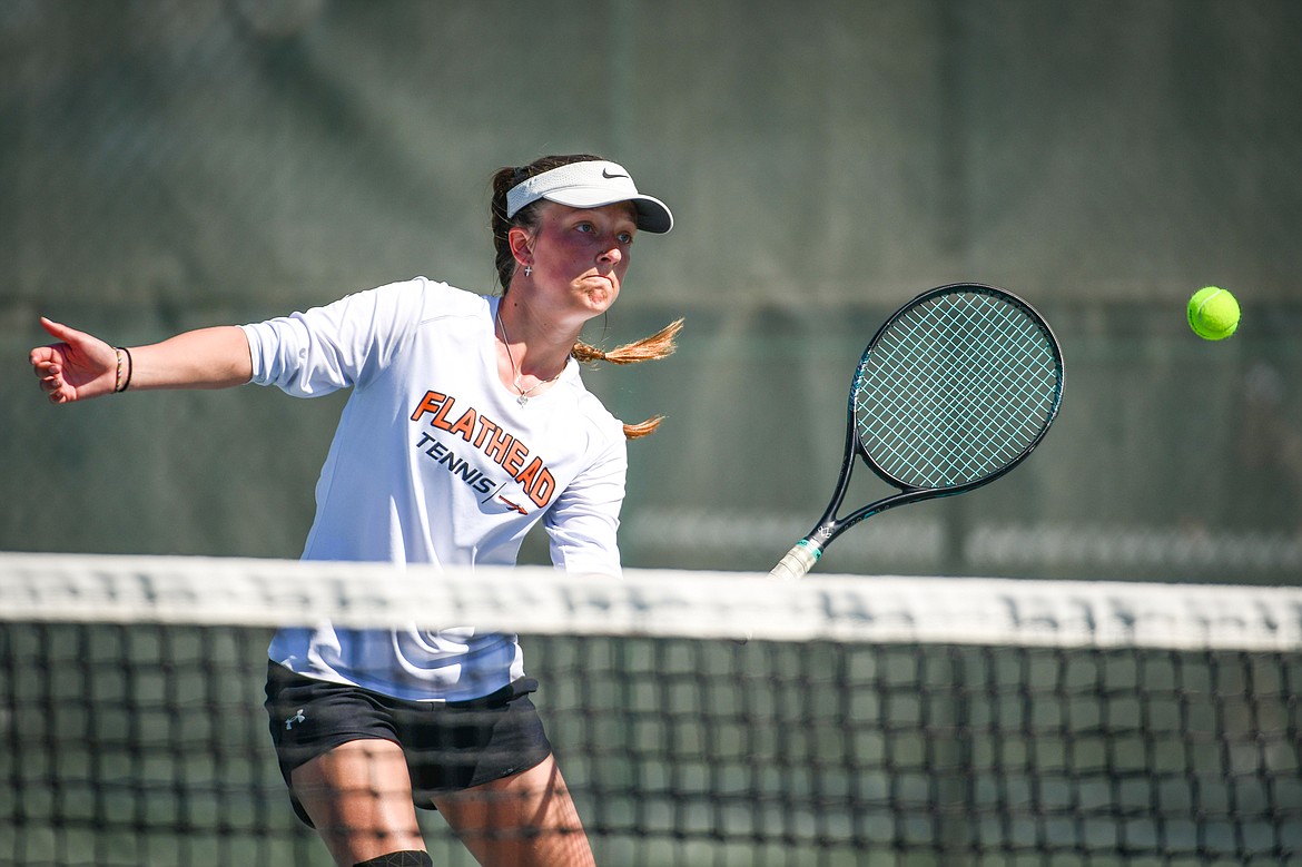 Flathead's Alexis Kersten hits a return against Missoula Big Sky's Addie Winward at the Western AA Invite at FVCC on Saturday, April 29. (Casey Kreider/Daily Inter Lake)