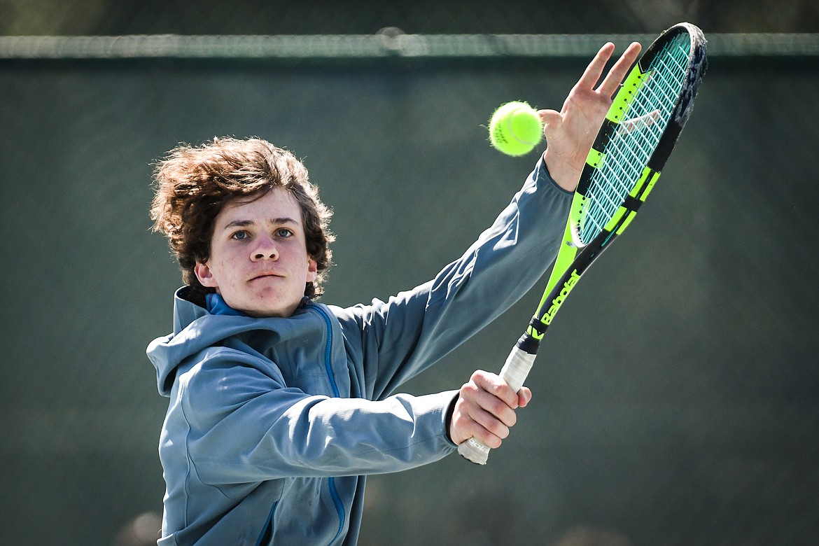 Glacier's Will Rudbach hits a backhand return against Missoula Big Sky's Jake Kientz at the Western AA Invite at FVCC on Saturday, April 29. (Casey Kreider/Daily Inter Lake)