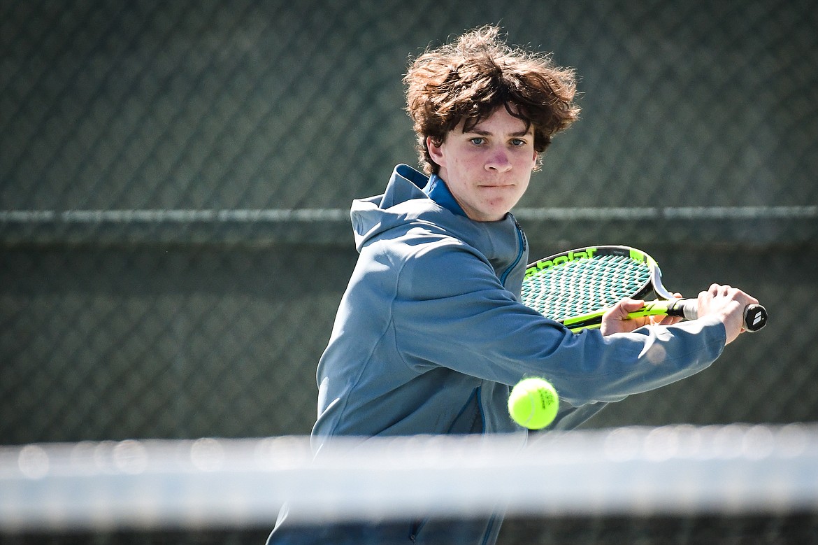 Glacier's Will Rudbach hits a backhand return against Missoula Big Sky's Jake Kientz at the Western AA Invite at FVCC on Saturday, April 29. (Casey Kreider/Daily Inter Lake)