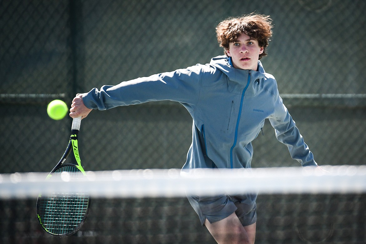 Glacier's Will Rudbach hits a backhand return against Missoula Big Sky's Jake Kientz at the Western AA Invite at FVCC on Saturday, April 29. (Casey Kreider/Daily Inter Lake)