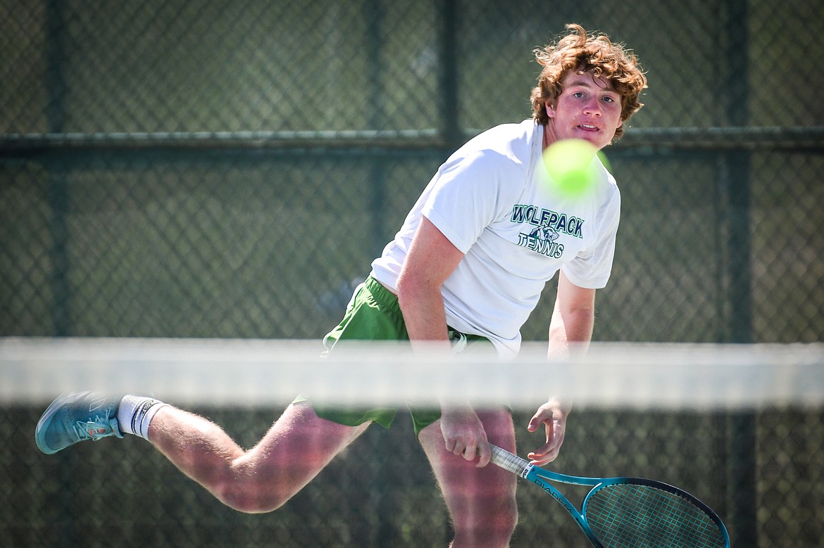 Glacier's Timmy Glanville serves in a boys doubles match with teammate Harrison Sanders against Glacier's Calvin Schmidt and Dalyn Mathison at the Western AA Invite at FVCC on Saturday, April 29. (Casey Kreider/Daily Inter Lake)