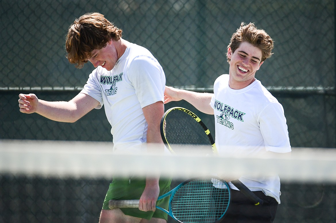 Glacier's Timmy Glanville and Harrison Sanders react after losing a point in a boys doubles match against Glacier's Calvin Schmidt and Dalyn Mathison at the Western AA Invite at FVCC on Saturday, April 29. (Casey Kreider/Daily Inter Lake)