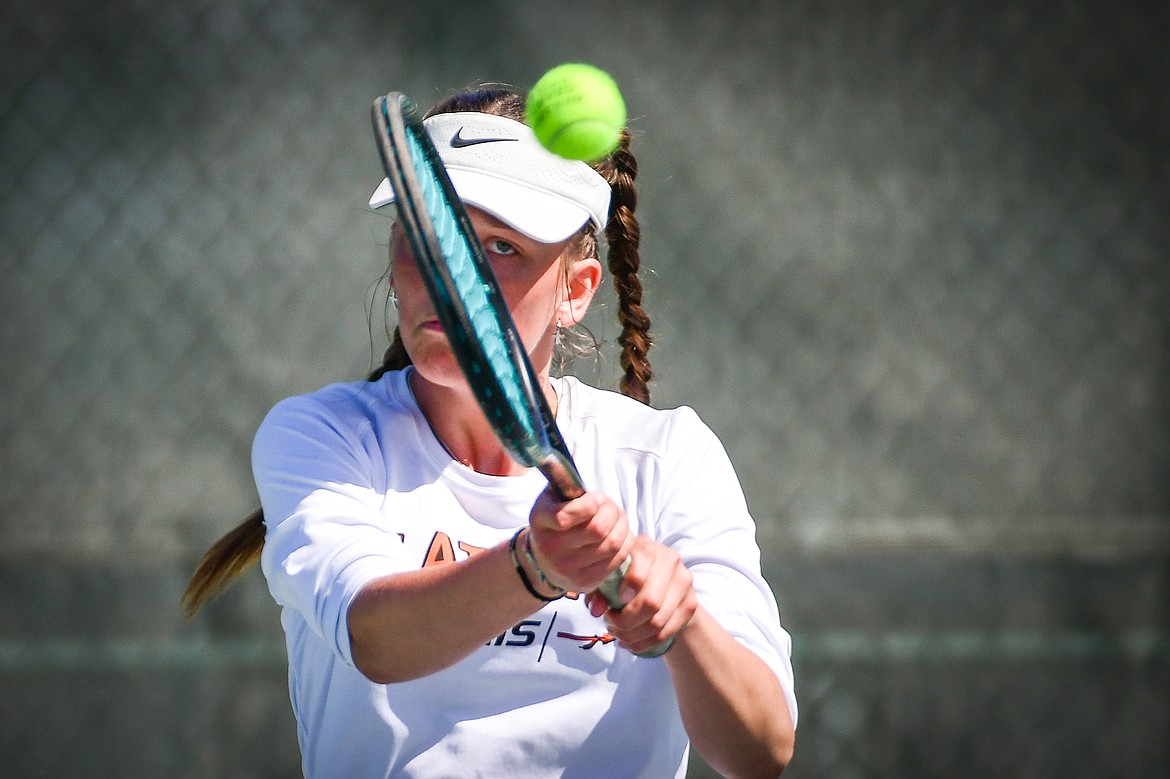 Flathead's Alexis Kersten hits a backhand return against Missoula Big Sky's Addie Winward at the Western AA Invite at FVCC on Saturday, April 29. (Casey Kreider/Daily Inter Lake)