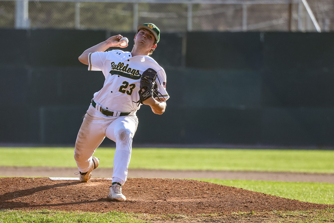 Bulldogs senior Ty Schwaiger pitches against the Columbia Falls Wildcats in Whitefish on Friday, April 28. (JP Edge/Hungry Horse News)