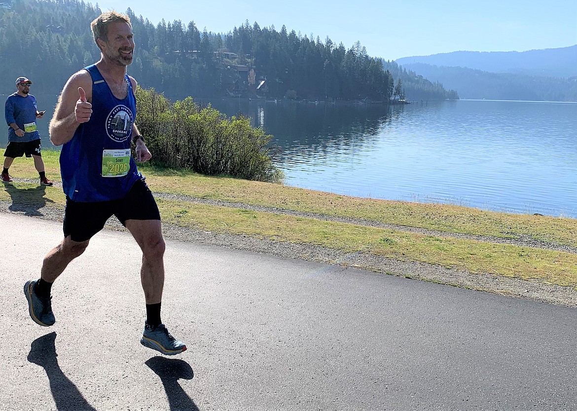 Scott Cooley, who finished second in the Spring Dash half marathon, runs on the North Idaho Centennial Trail on Saturday.