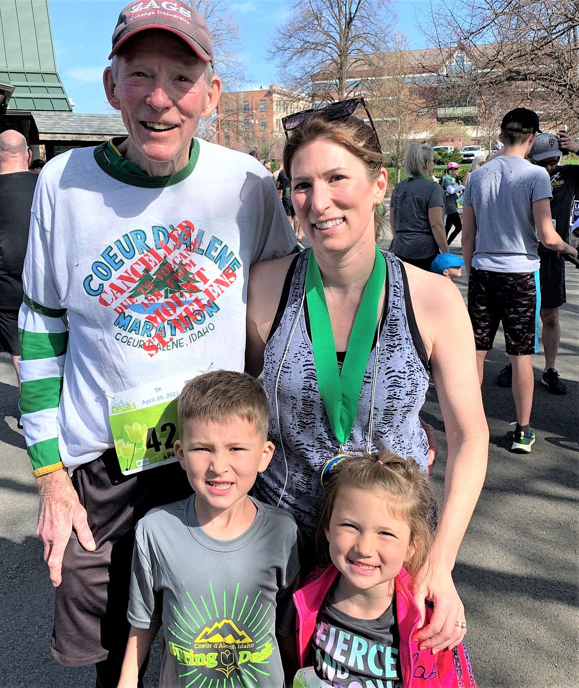 Three generations come together at the Spring Dash on Saturday. John Giesen is joined by daughter Brenna Cowan and grandchildren Emmett and Huxley at the finish line at McEuen Park.