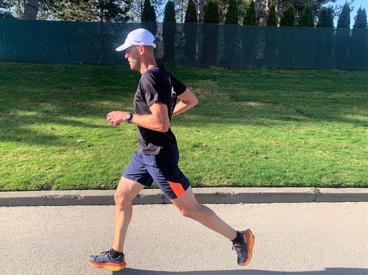 Troy Braga of Coeur d'Alene leads the Spring Dash half marathon on Mullan Avenue on Saturday.