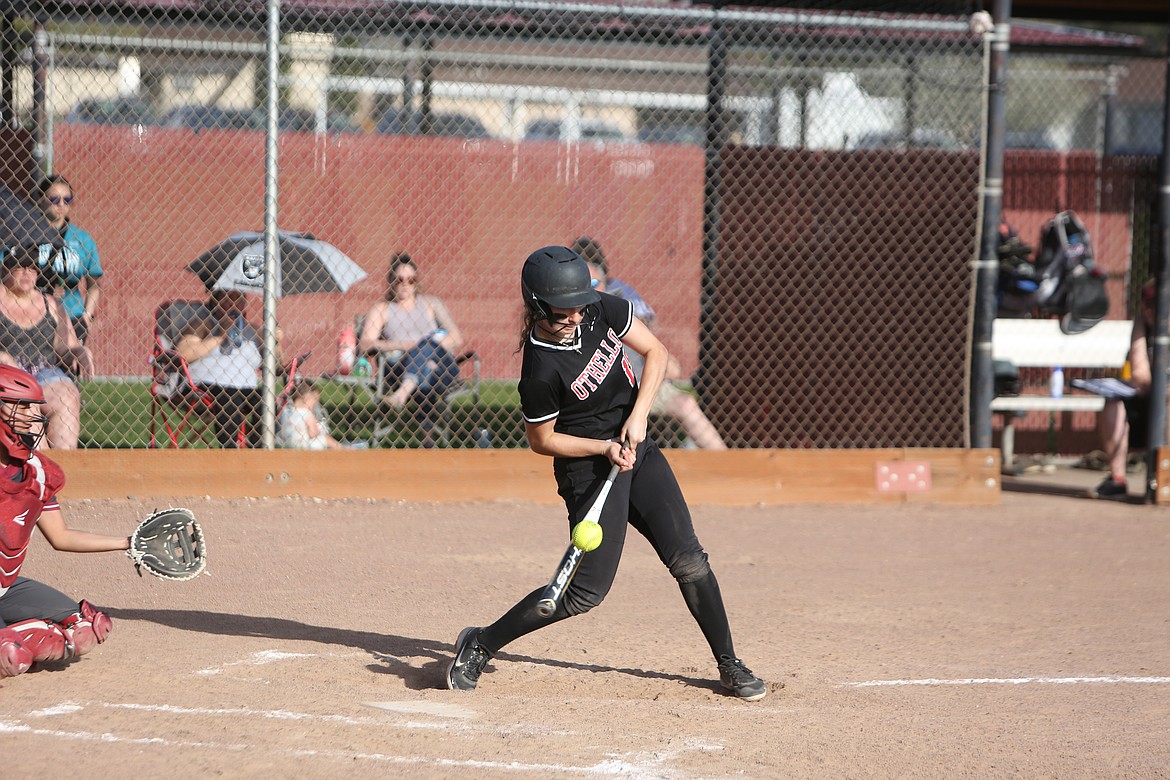 Othello senior Natalie Martinez makes contact with a pitch during Othello’s 15-0 win over Grandview on Friday.