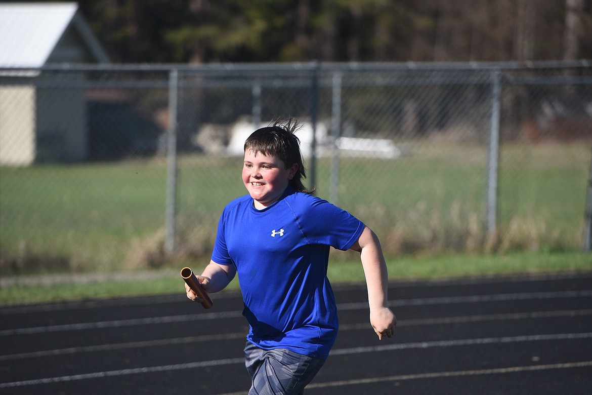Unseasonably warm weather greeted Libby Elementary School students at the annual track meet on Friday, April 28. But few complaints were heard as temperatures climbed to about 80 degrees. (Scott Shindledecker/The Western News)