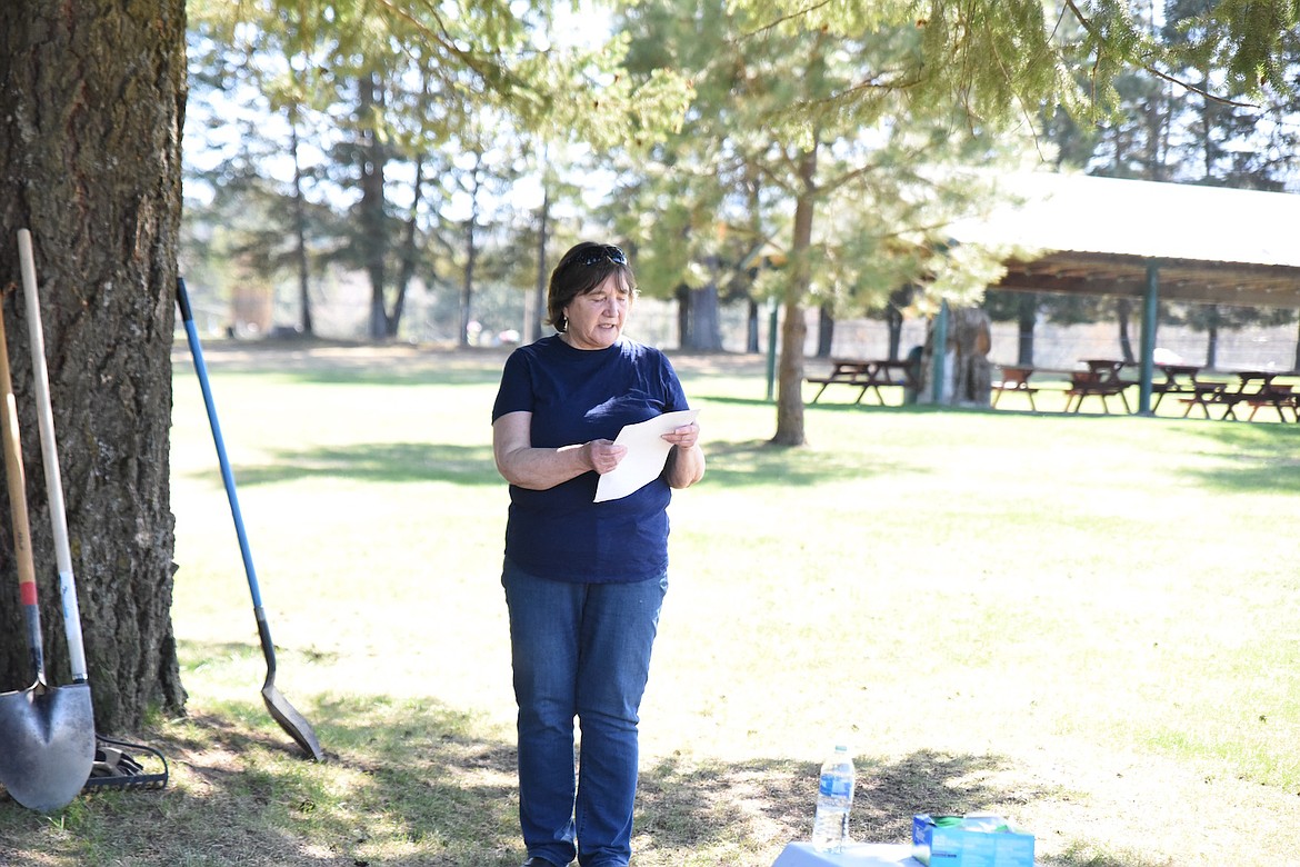 Mayor Peggy Williams reads a proclamation at Fireman Park in Libby on Friday, April 28, during Arbor Day festivities. (Scott Shindledecker/The Western News)