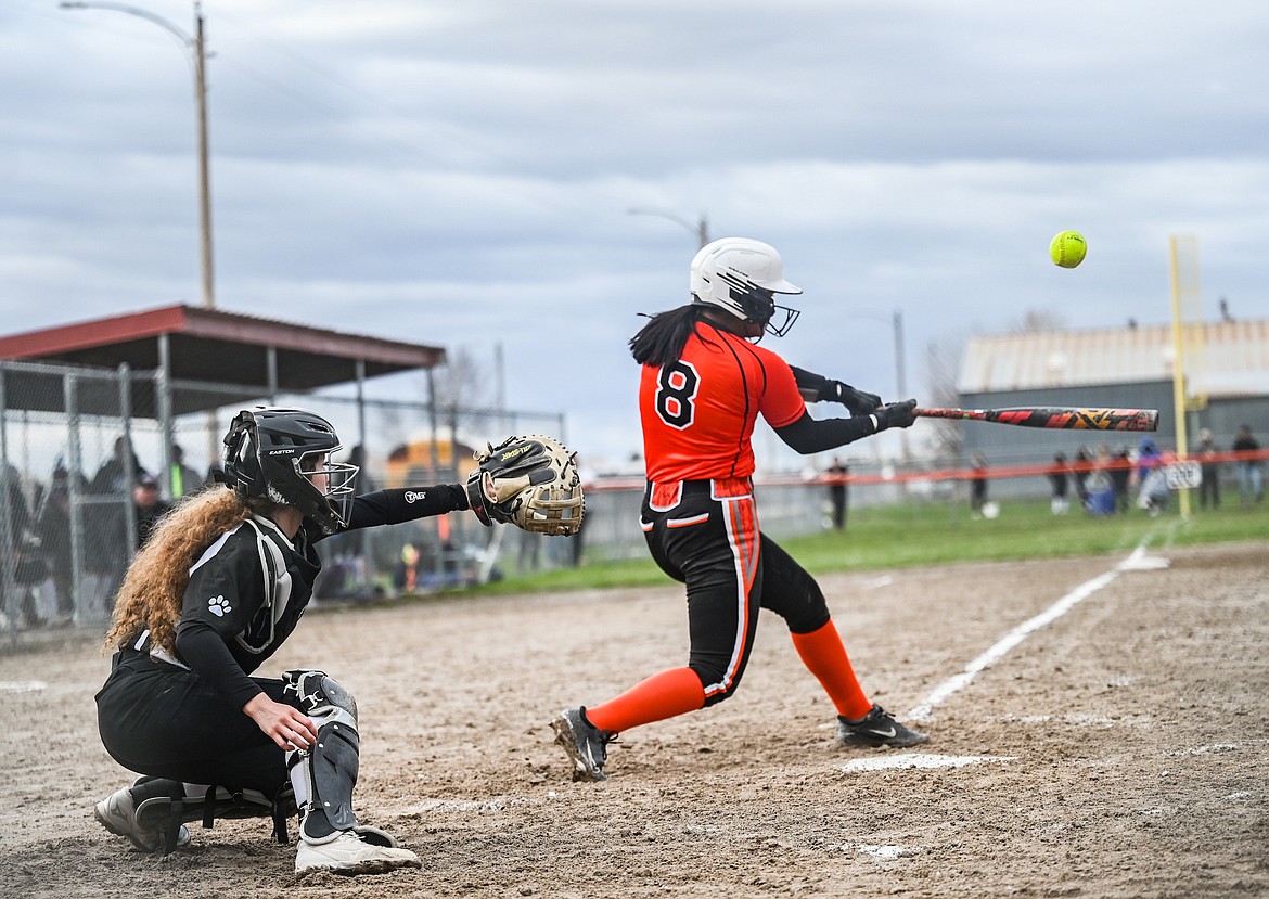 MAC catcher Lettie Umphrey reaches for the ball as Maiden Kaleigh Benson aims for a hit during last week's MAC-Ronan game. (Christa Umphrey photo)