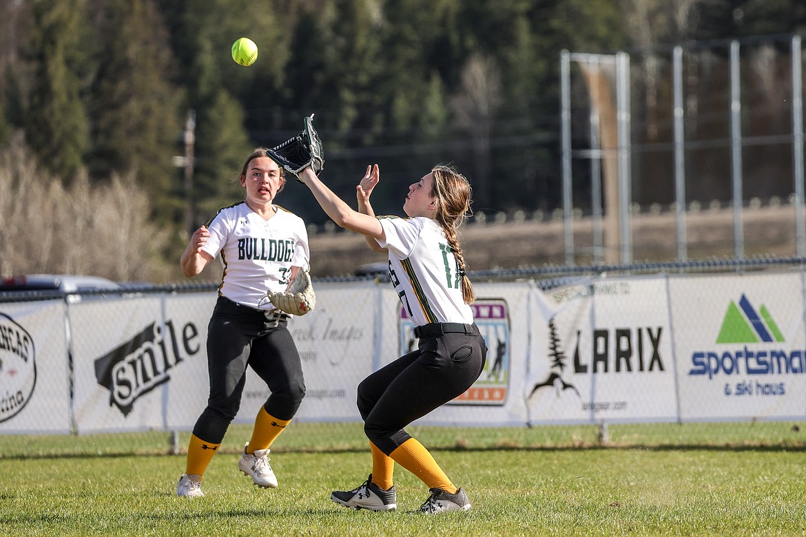 Whitefish junior Kaci Hill goes for a fly ball to the outfield against the Wildkats at home on Thursday. (JP Edge photo)