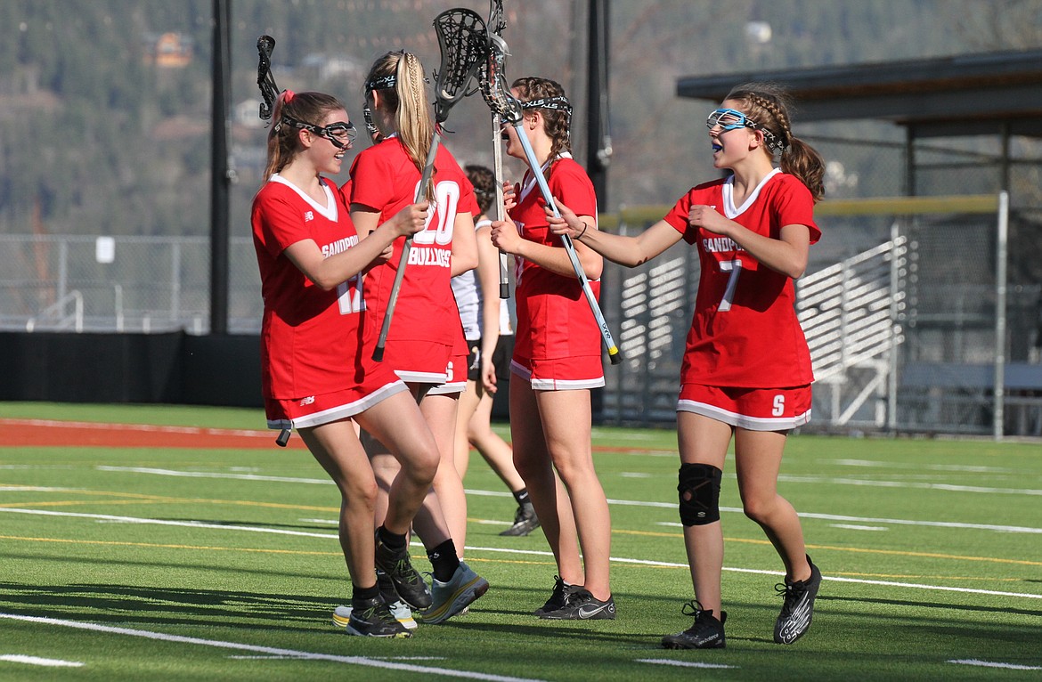 Marine Browne celebrates a goal with her teammate, Grace Gavin.