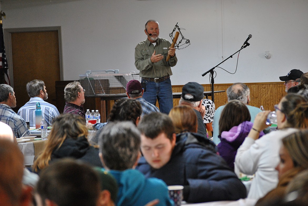 During the Wild Game Dinner in St. Regis last Wednesday, Matt Kelley from Alabama, holds up an animal trap as a visual reminder of what it's like to be addicted to drugs or alcohol. Kelley has been sober for many decades now and travels around the states through his foundation, Equip Ministries to talk to youth about the dangers of drugs and alcohol. (Amy Quinlivan/Mineral Independent)