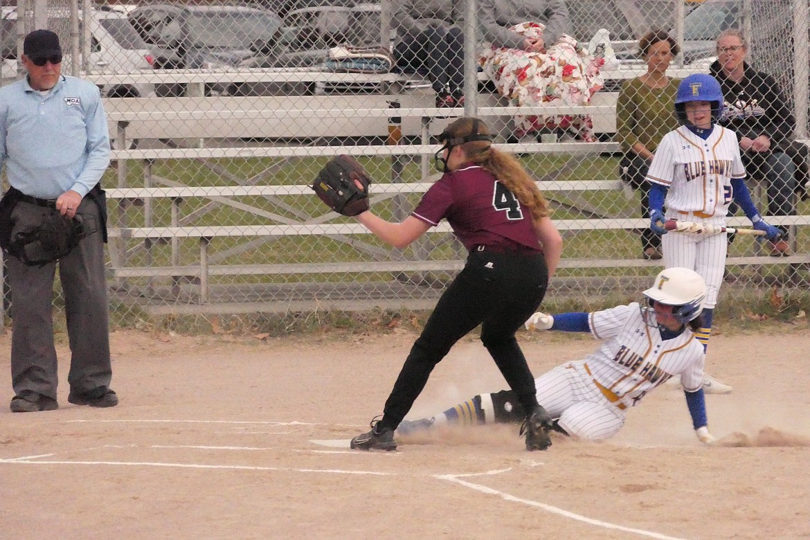 Thompson Falls sophomore Olivia Fitchett slides safely into home during the Lady Hawks game against Troy last week in Thompson Falls. (Chuck Bandel/VP-MI)