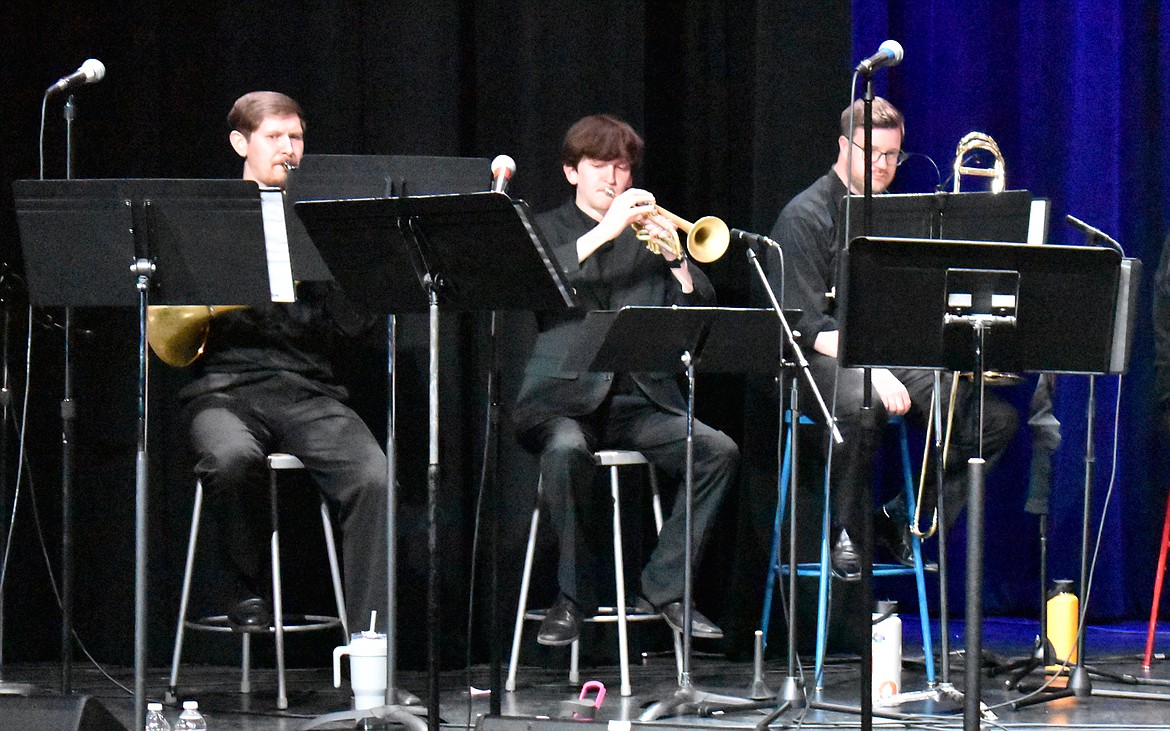 Moses Lake resident Nathan Fisher, center, plays trumpet with the Seattle Rock Orchestra. Fisher was a last-minute replacement for the orchestra’s usual trumpeter, he said.