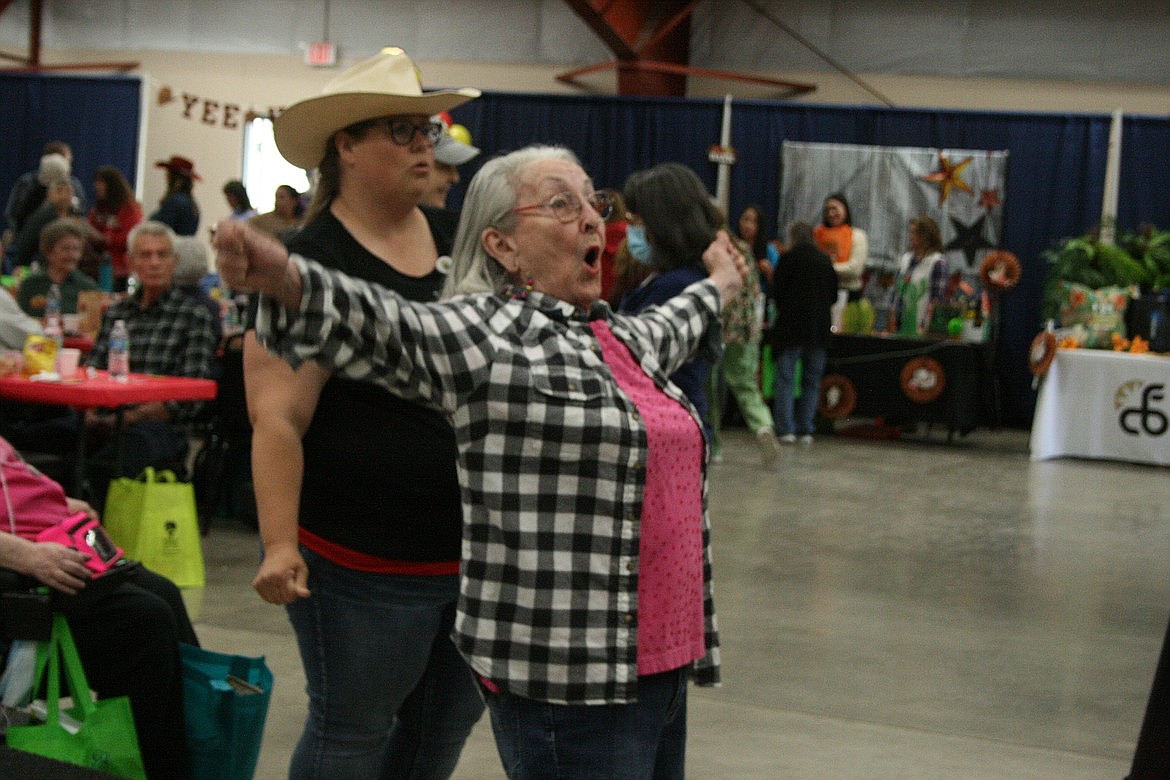 Betty Schafer sings along with the band during the 2022 Senior Picnic last June at the Grant County Fairgrounds. The annual event brings volunteers and seniors together in a party-like atmosphere that ensures area seniors have an opportunity to blow off a little steam.