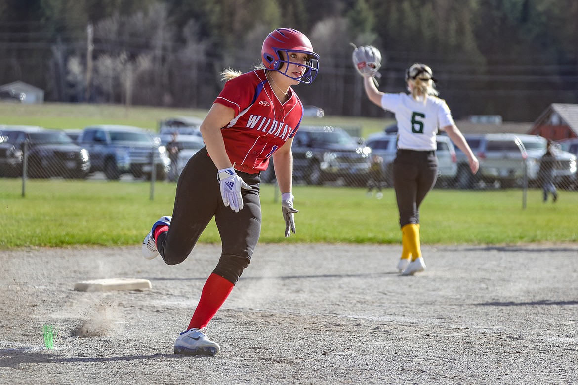 Senior Sydney Mann rounds third for home in Whitefish on Thursday. (JP Edge photo)