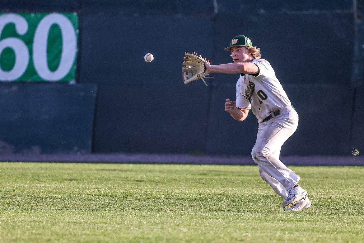 Whitefish sophomore Jake McIntyre catches a line drive to the outfield on Friday at home. (JP Edge photo)