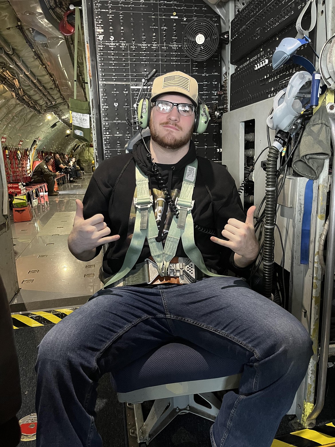 Lakeland High School junior Brent Hill sits strapped into the seat directly behind the cockpit on a KC-135, where he watched the plane descend and land at Fairchild Air force Base April 26. Brent was one of three students who won an Air National Guard essay contest to accompany a flight to refuel another plane in the air.