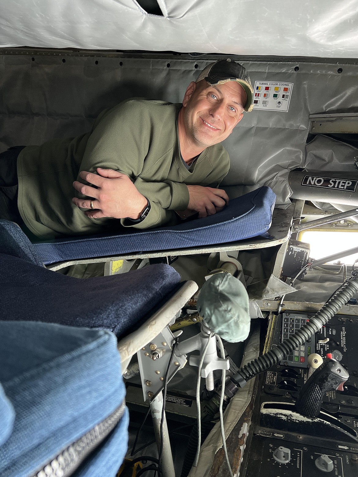 Student Resource Officer John Hatcher, one of three staff members from Lakeland High School invited to accompany students on a refueling flight with the Air National Guard, explores the inside of a KC-135 plane. The roughly 3-hour flight traveled over Oregon, Washington and Idaho before landing back at Fairchild Air Force Base.