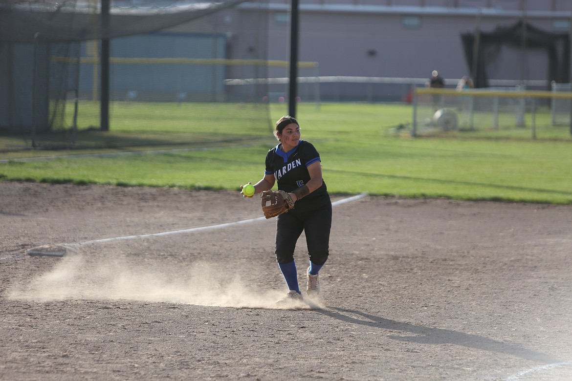 Warden freshman Jamy Pruneda looks toward second base after picking up a ground ball against Royal on Tuesday.