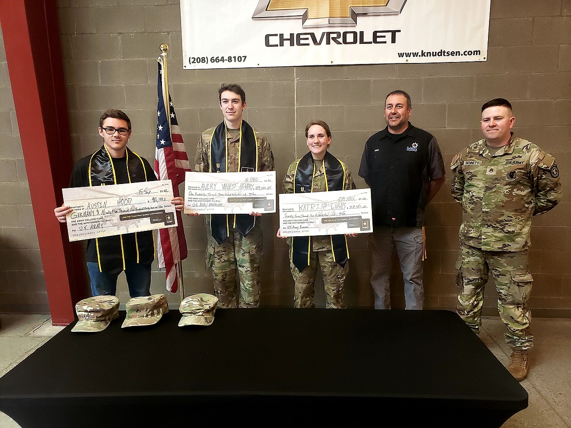 From left, KTEC students Austin Hood, Avery Wuest-Hendry, Katrina Evans, Instructor John Mackesy, and Army recruiter Staff Sgt. James Bennett pose to celebrate the job positions and up to six-year commitments students made the army after they graduate.