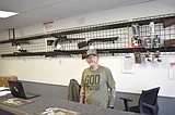 Local gun shop files suit over weapon ban