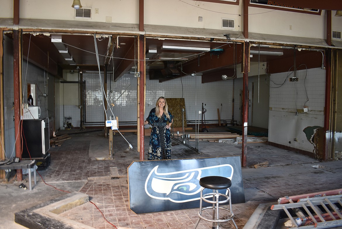 Anna Van Diest stands in the area that will house the brewing equipment for Moore Brewing Company in the former Broadway Bar & Grill building. The brewery is tentatively expected to open in August, co-owner Lori Moore said.