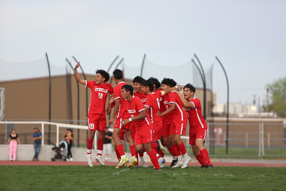 Othello players gather together to celebrate the Huskies’ win over Grandview in a shootout on Wednesday.