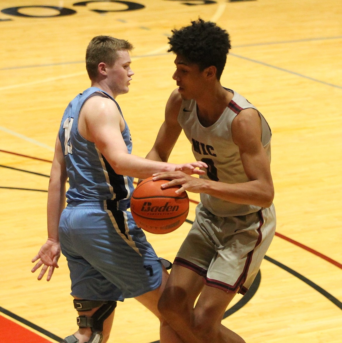 JASON ELLIOTT/Press
North Idaho College forward Julius Mims dribbles into the key on Spokane's Tanner McCliment-Call during a Feb. 23, 2022 game at Rolly Williams Court.