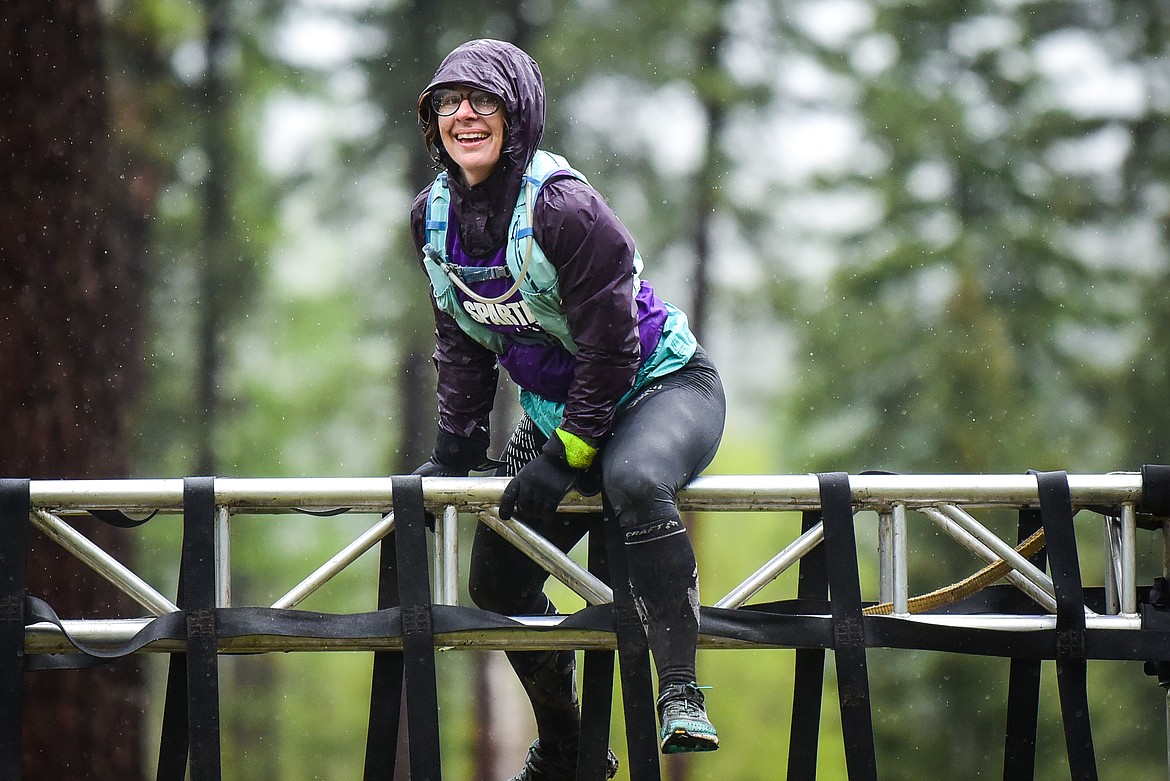 A competitor pauses atop an obstacle at the Montana Spartan Trifecta in Bigfork on Saturday, May 6. (Casey Kreider/Daily Inter Lake)