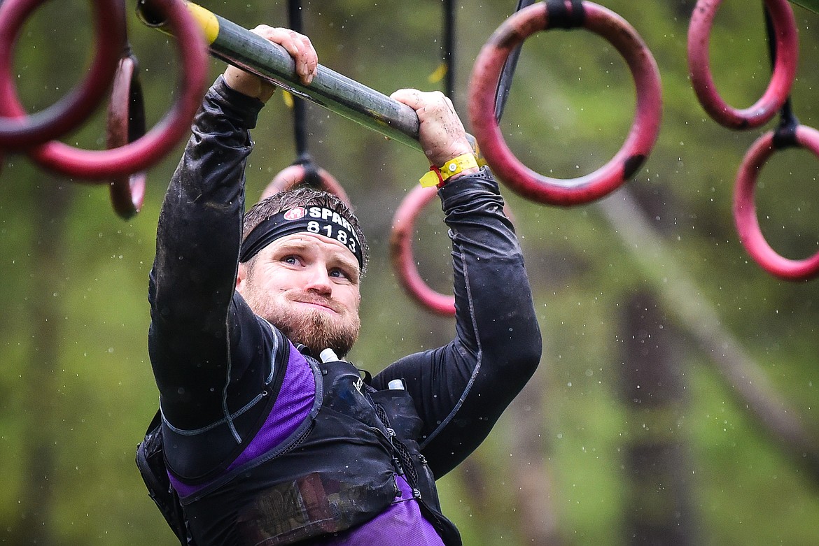Andy Jones, from Wenatchee, Washington, nagivates the Multi-Rig obstacle at the Montana Spartan Trifecta in Bigfork on Saturday, May 6. (Casey Kreider/Daily Inter Lake)