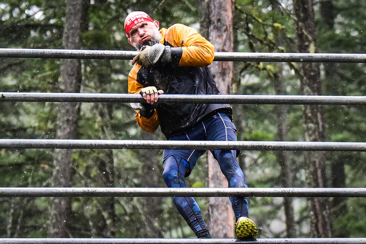 Ireland MacBradaigh, from Puyallup, Washington, climbs over the bender obstacle at the Montana Spartan Trifecta in Bigfork on Saturday, May 6. (Casey Kreider/Daily Inter Lake)