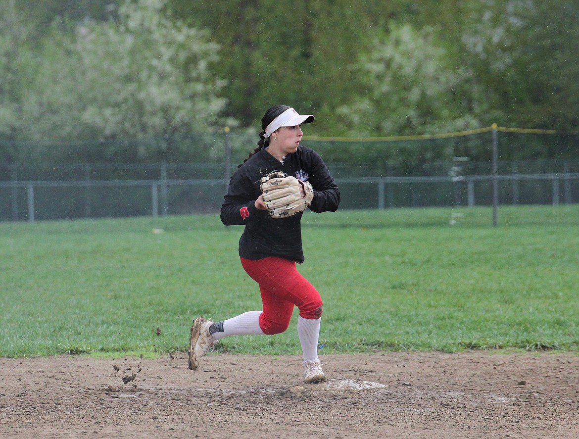 Ali Knowles steps on the bag to make an out at second base.