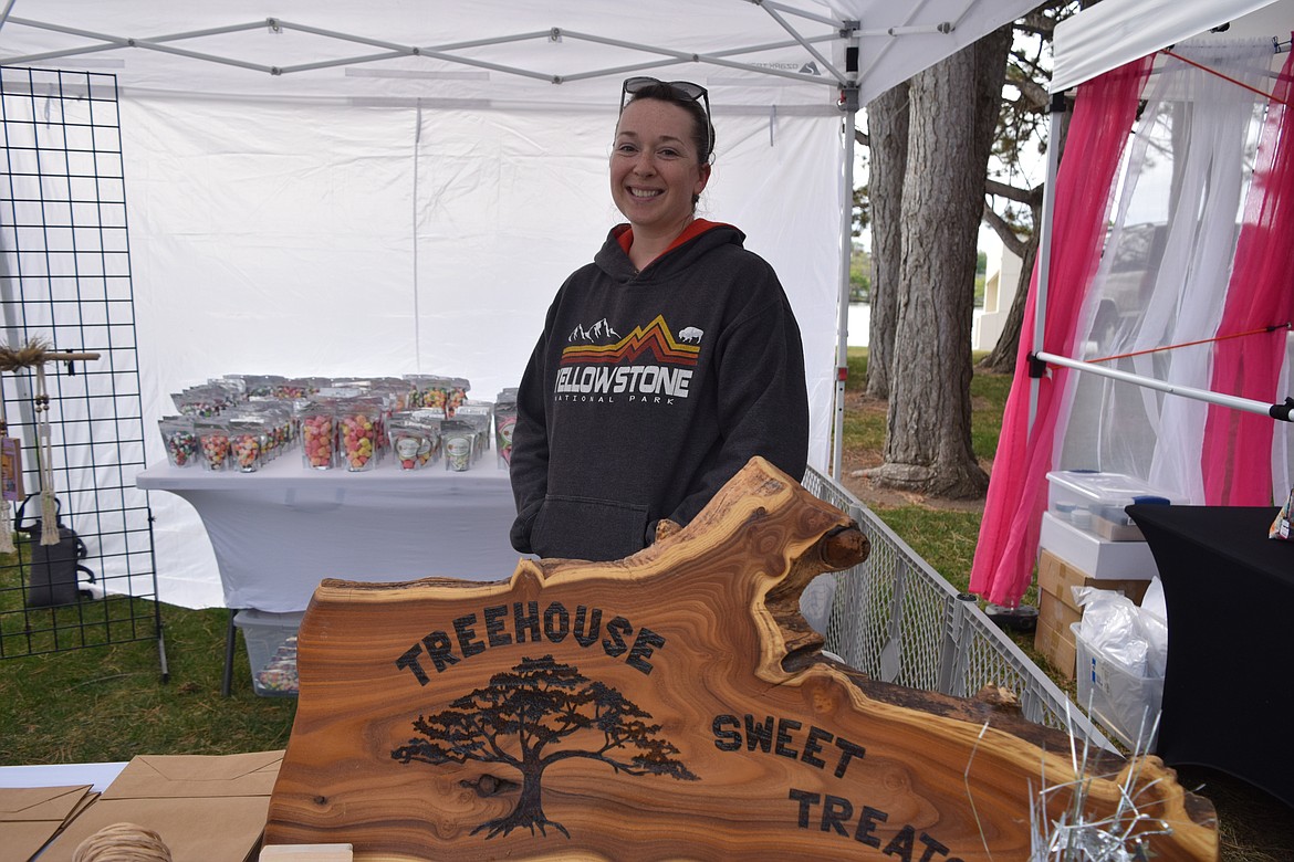 Christina Johnson, owner of Treehouse Sweet Treats in Moses Lake, selling her wares at the first open-air Moses Lake Farmers Market of the year at McCosh Park in Moses Lake on Saturday.