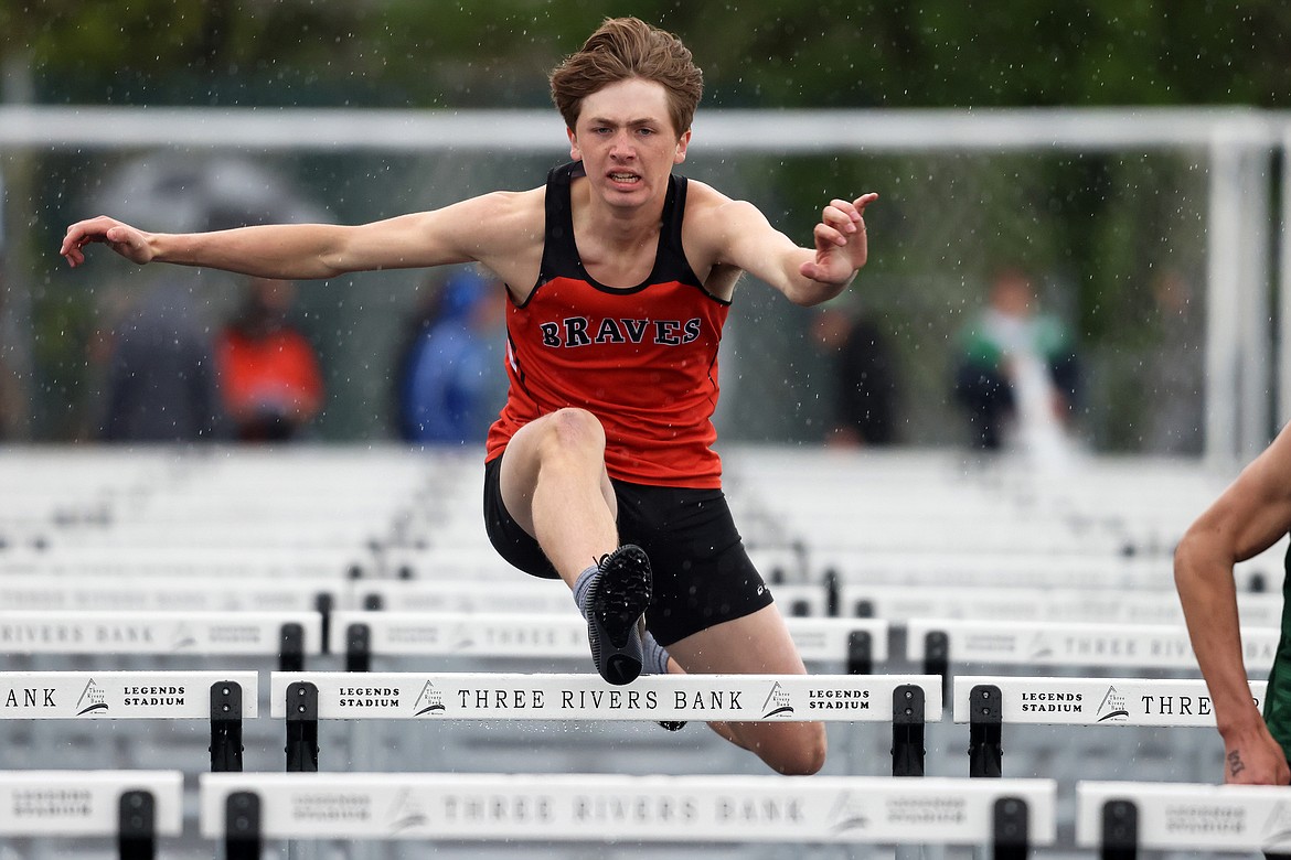 Flathead’s Michael Manning clears a hurdle in the 110-meter hurdle race at the 44th Archie Roe Invitational at Legends Stadium on Saturday, May 5. (Jeremy Weber/Daily Inter Lake)