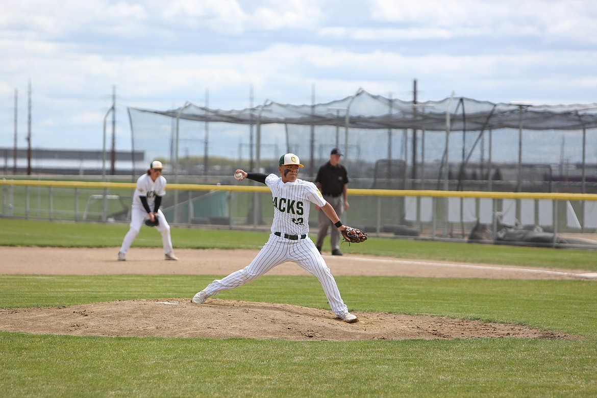 Quincy sophomore Evander Stephens pitches during the second inning of Saturday’s 5-2 win over Omak. Stephens recorded six strikeouts in his start on the mound.