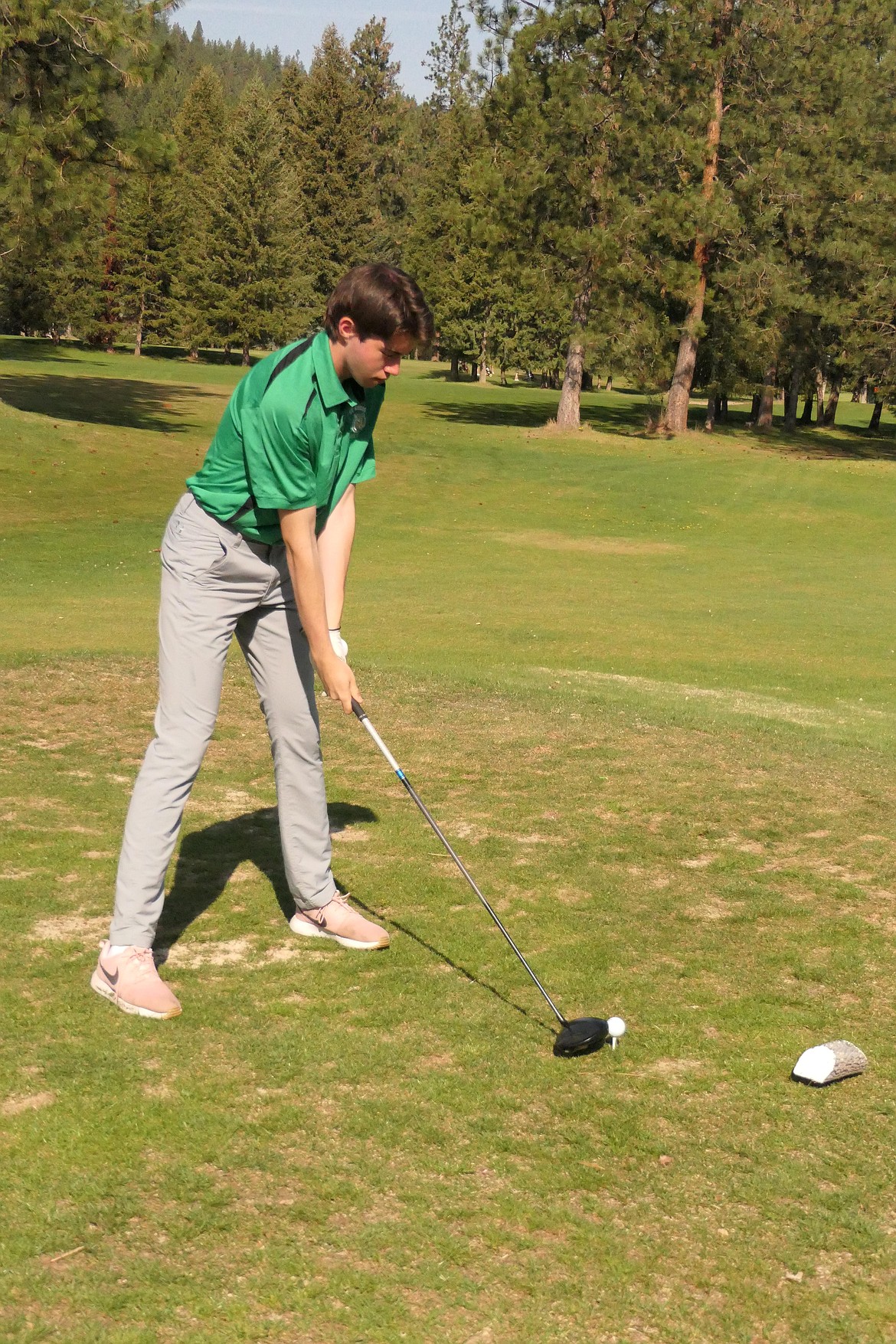 St. Regis golfer Jack Connolly gets ready to tee off during the St. Regis Invitational high school golf tournament this past week at Trestle Creek Golf Club near St. Regis.  Connolly shot an 18-hole score of 80 to win individual honors.  (Chuck Bandel/VP-MI)